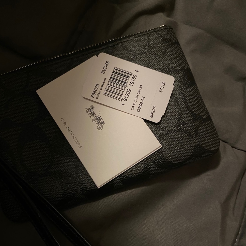 Brand new black coach leather wristlet